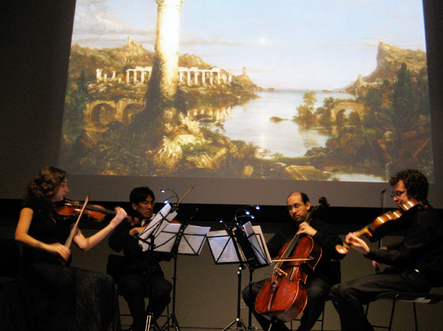 String quartet in front of projection screen
